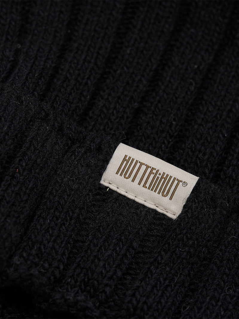 Wełniana czapka z pomponem z alpaki Huttelihut BÉBÉ Concept 