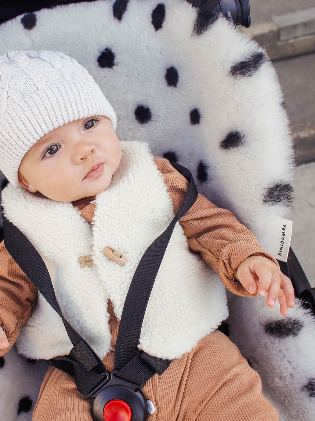 Natural sheepskin snuggler DALMATIAN DOVE